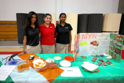 Students participate in Culture Fair by setting up a booth.