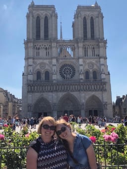 Mrs. Hall and her daughter in front on Notre Dame in Paris