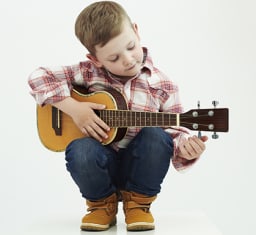 child with ukulele
