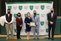 Marla Pascucci-Byrne receiving the St. Augustine Lumen Award