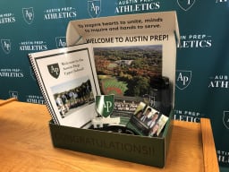 Accepted students receiving welcome package from Austin Prep admissions office
