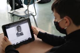 Student studying Black inventor contributions in classroom project