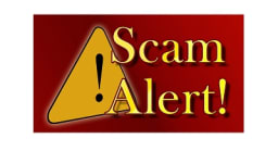 Caution sign with Scam Alert written in words