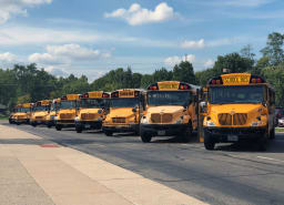 Image of several school buses parked at Centerville High School