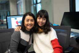 A student poses for a photo with her mom during Parents' Weekend 2018