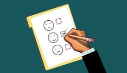 Clip art of hand filling in bubbles with happy and sad faces.