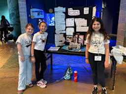 ZOOMS third place winners with presentation