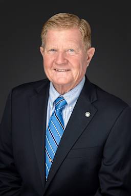 our board member Mr. Phillip Townsend wearing a suit