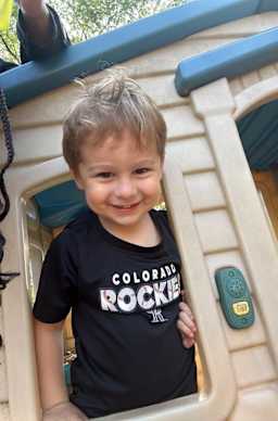 Boy playing in playhouse on playground
