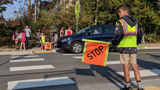Elementary school patrol kids guarding the corners for safety. St
