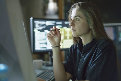 girl accessing data on computers