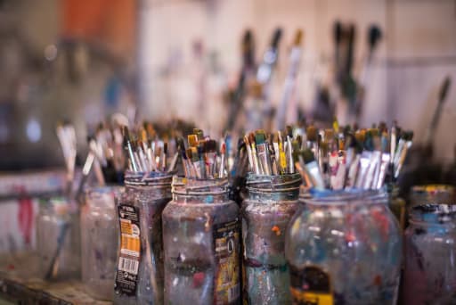 Jars of paint brushes