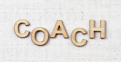 coach spelled out in wooden letters