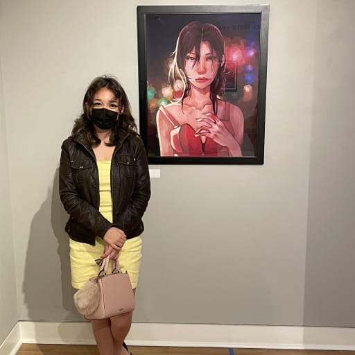 Ashlyn Turner with Artwork at Delaplaine Art Center