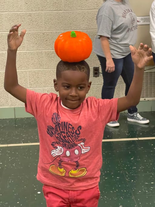 Robinwood Green Team Harvest Party pumpkin relay race