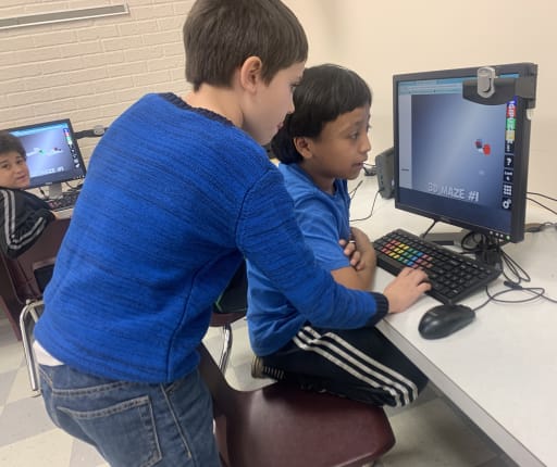 Robinwood computer lab boys working together