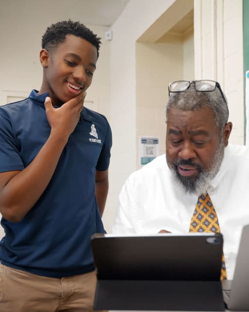 Teacher working with student in the classroom