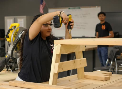 Training and hands-on carpentry work in a classroom setting.