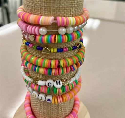 Students craft 500 friendship bracelets for charity gala