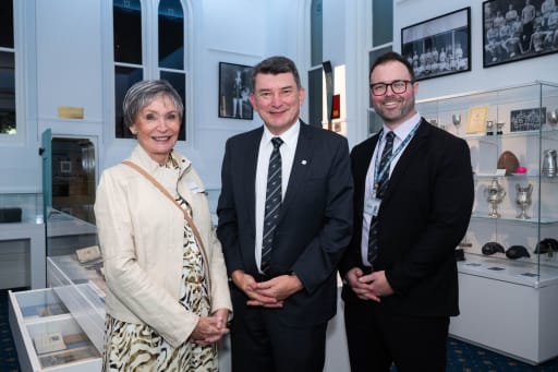 Mayre Fenwick, Chris Price, and Brett Walker-Davies stand for a photo in the Museum