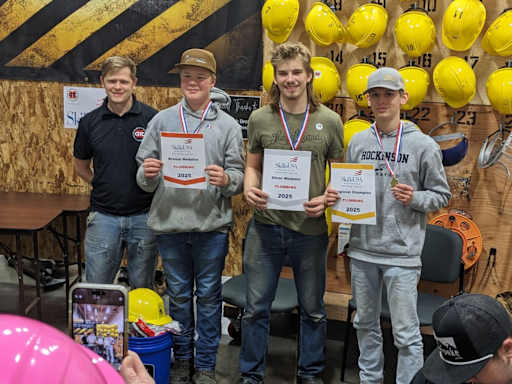 HHS students Lars Sarkinen (pictured: second from left) and Renner James (far right)  hold their awards from the SkillsUSA regional competition.
