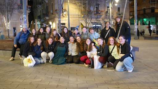 Aliyah Chet poses with past b'not sherut on Ben Yehuda Street