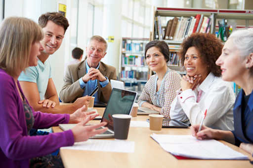 Educators sitting around a table
