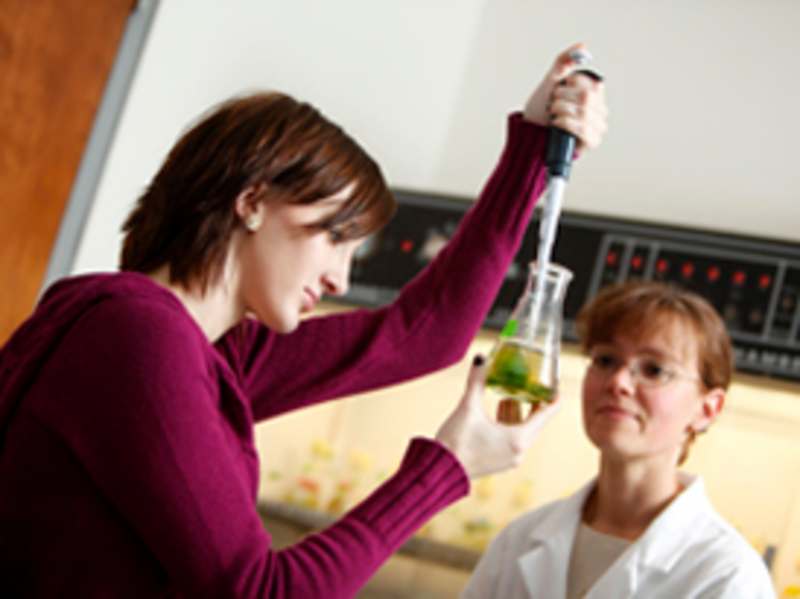Biology faculty member working alongside a Misericordia student