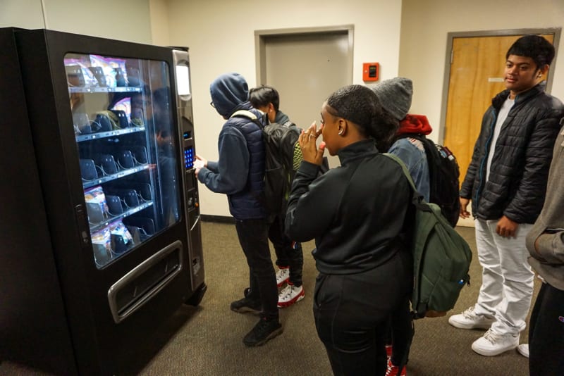 A group of Tyee students line up to use the new vending machine.