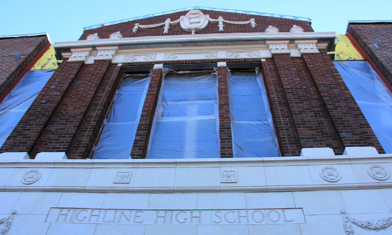 View of reconstructed historic main entrance with original terracotta details (December 1, 2020).