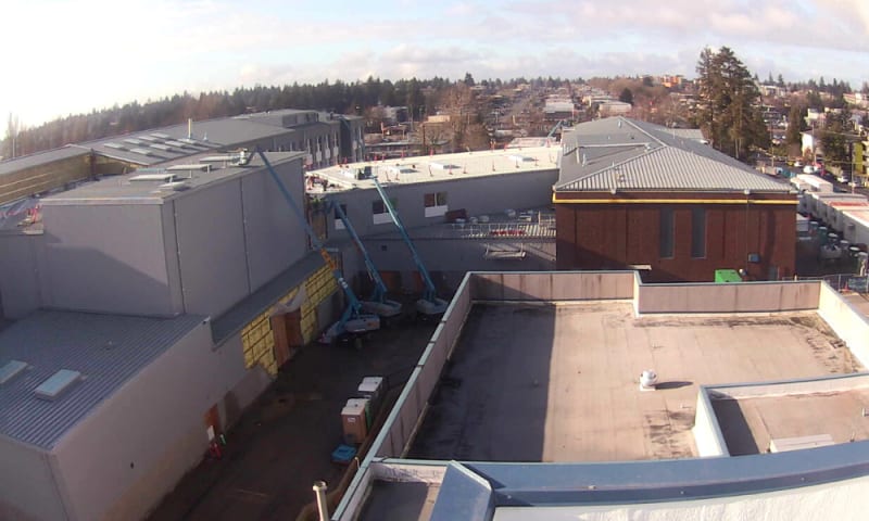 View looking west from the PAC roof (right to left) of the north wing, commons, theater and north wing.