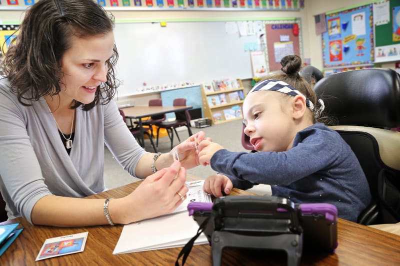 student and teacher practicing speaking