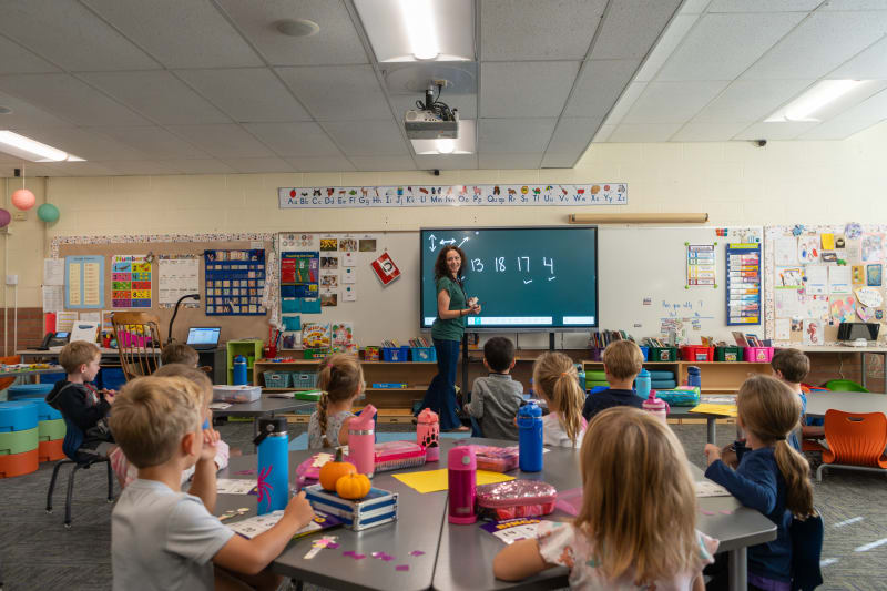 teacher in a classroom full of students