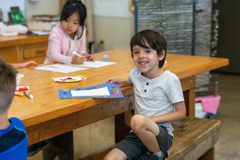 Camper enjoying making art.