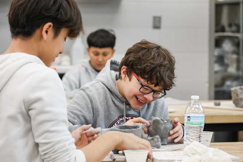 Student working on clay project