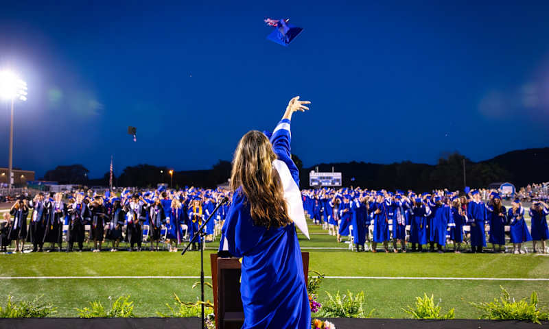 Students toss graduation caps