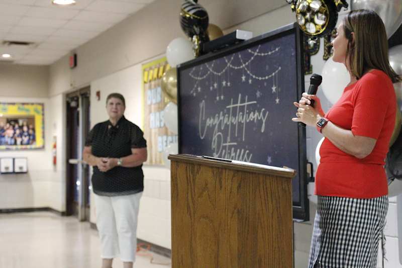 Dawn Tysinger, Ph.D., executive director of Student Wellness & Support, recognizes Pam Goodman, the first administrator of the school district's Learners Involved in Flexible Education program, who has been a teacher and school administrator in the district for 27 years.