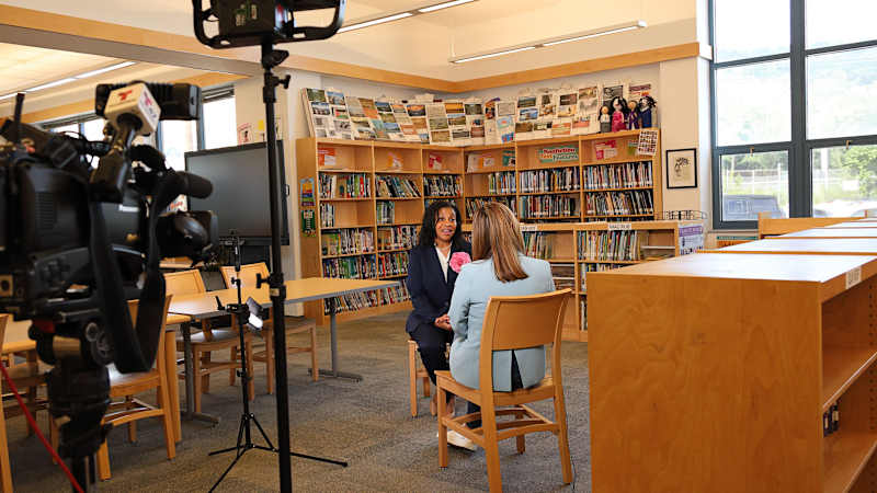 Dr. Laurie W. Newell being interviewed in 2024