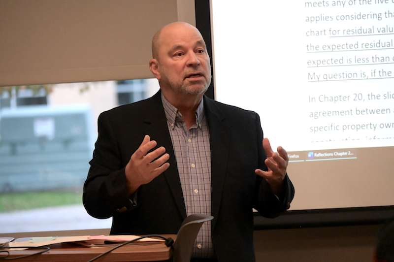 Professor teaching students