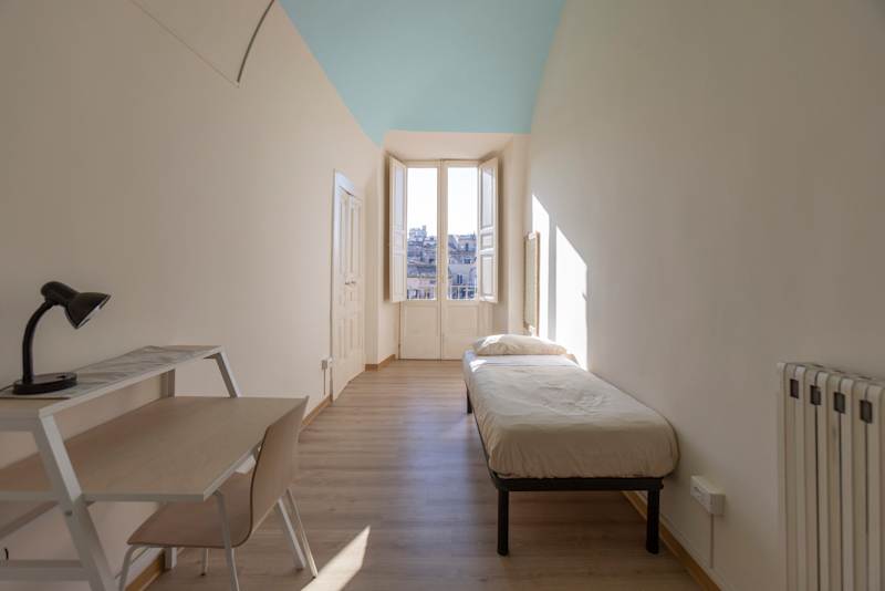 A single student room inside Palazzo De Giorgio