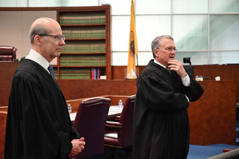 Two judges interact with Atlantic City High School students from the Public Safety Academy.