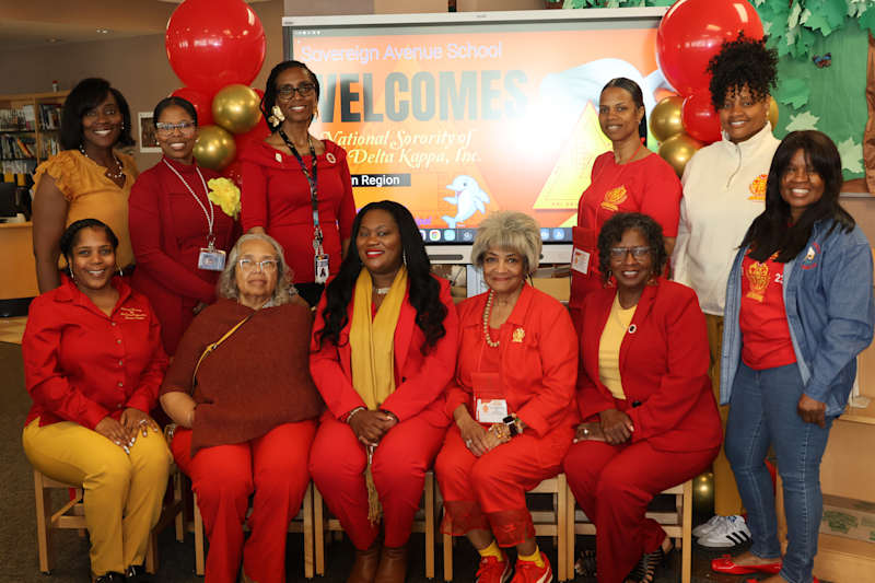 Members of the National Sorority of Phi Delta Kappa are seated for a photo.