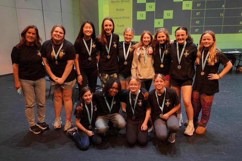 Roland-Grise Middle School Battle of the Books team celebrating with their trophy