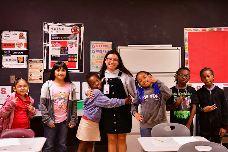 Teacher resident working with students