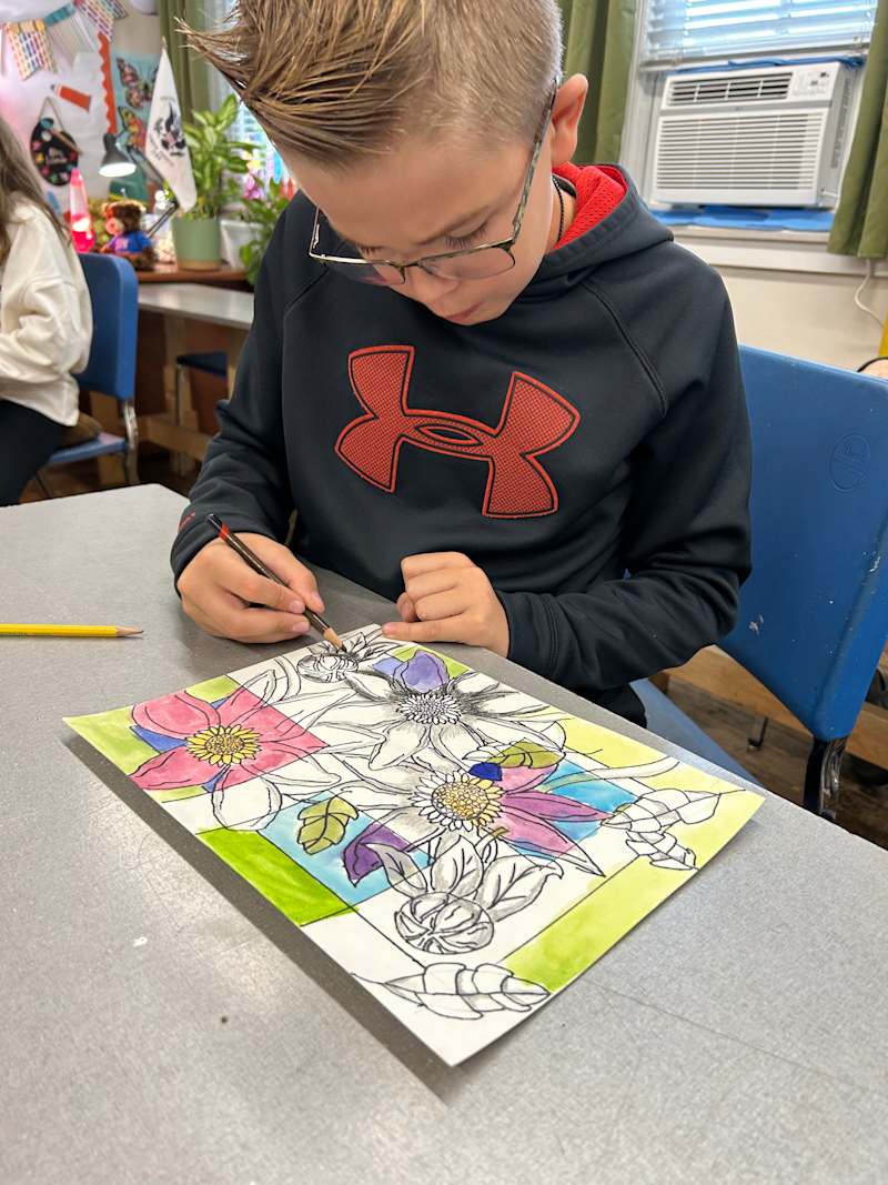 Elementary students participating in art class