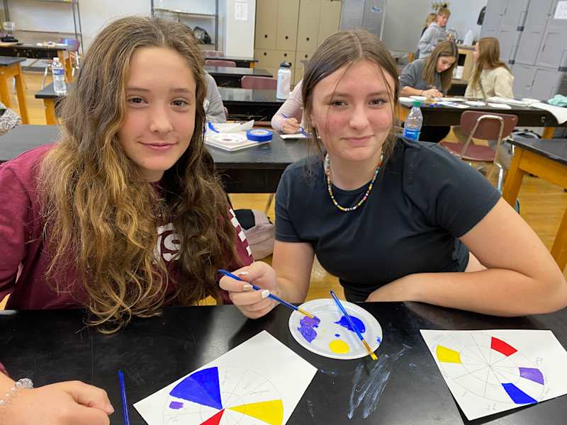 Student working on a painting