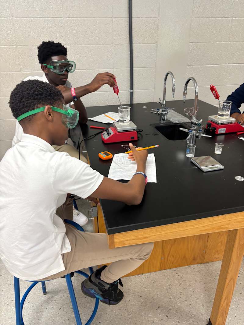 Two CMHS students conducting a hands-on science laboratory investigation