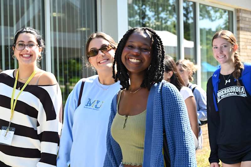 Misericordia University students smiling in the Banks Student Life Center