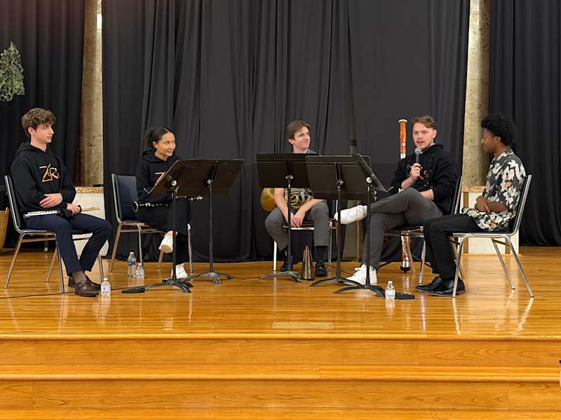 ZaRiah performing for students at Trinity Academy