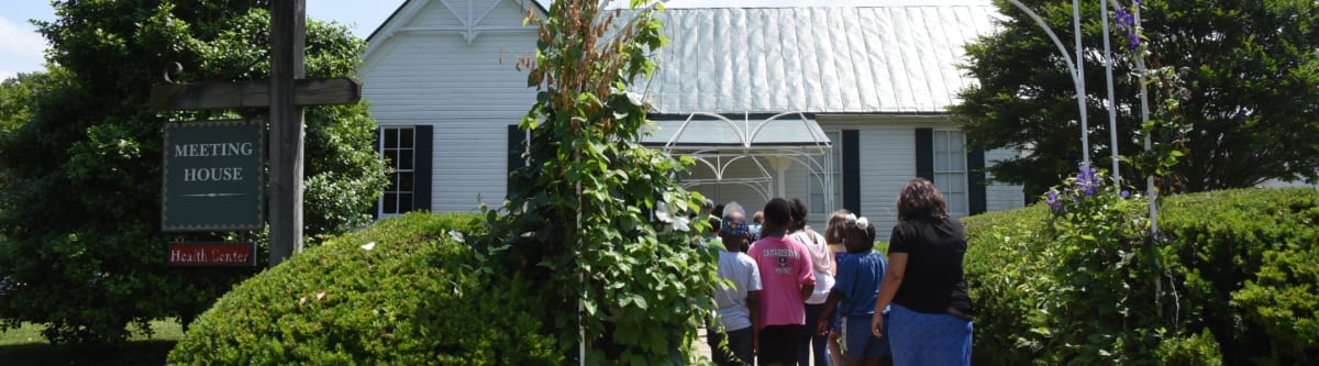 students enter the meeting house
